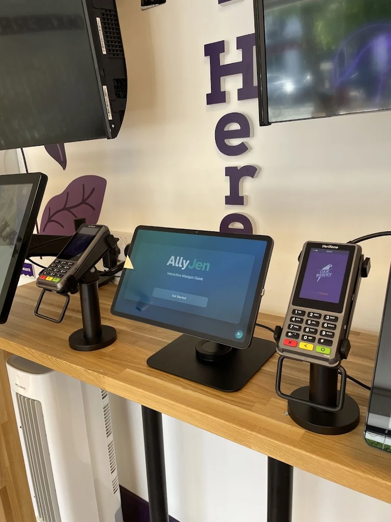 A tablet displaying the AllyJen interactive allergen guide on the counter at OAKBERRY Maynooth